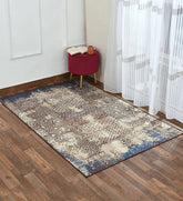 Machine washable mosaic area rug in muted tones.